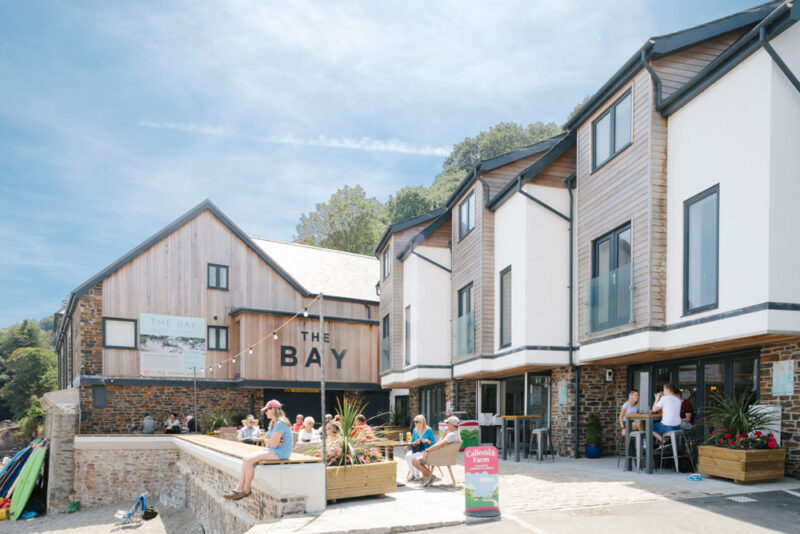 People drinking at The Bay bar and restaurant on the way to Penlee Point