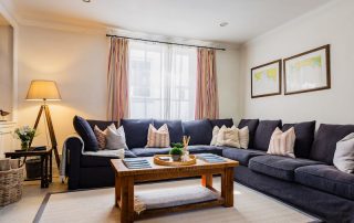 Luxurious living room with our cosy fire | Blue Monkey Cornwall